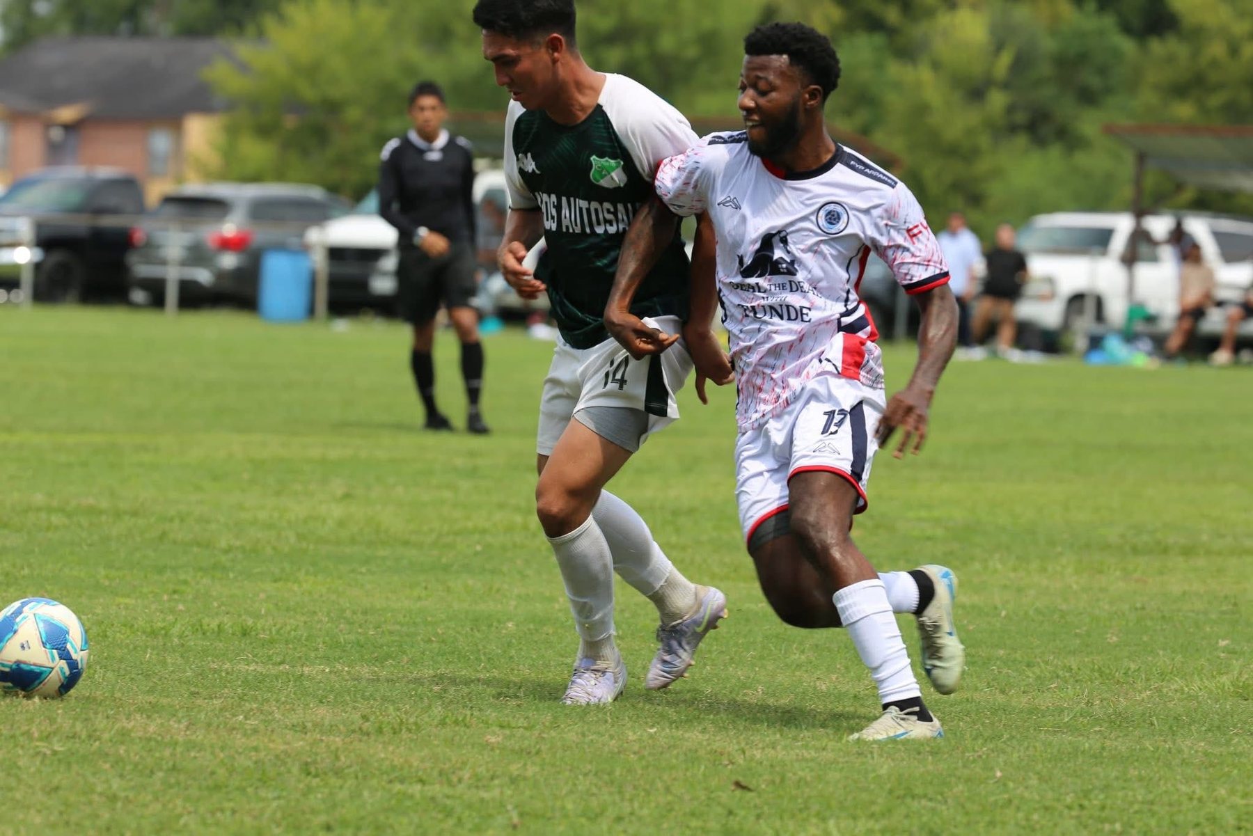 Football players competing during a community match