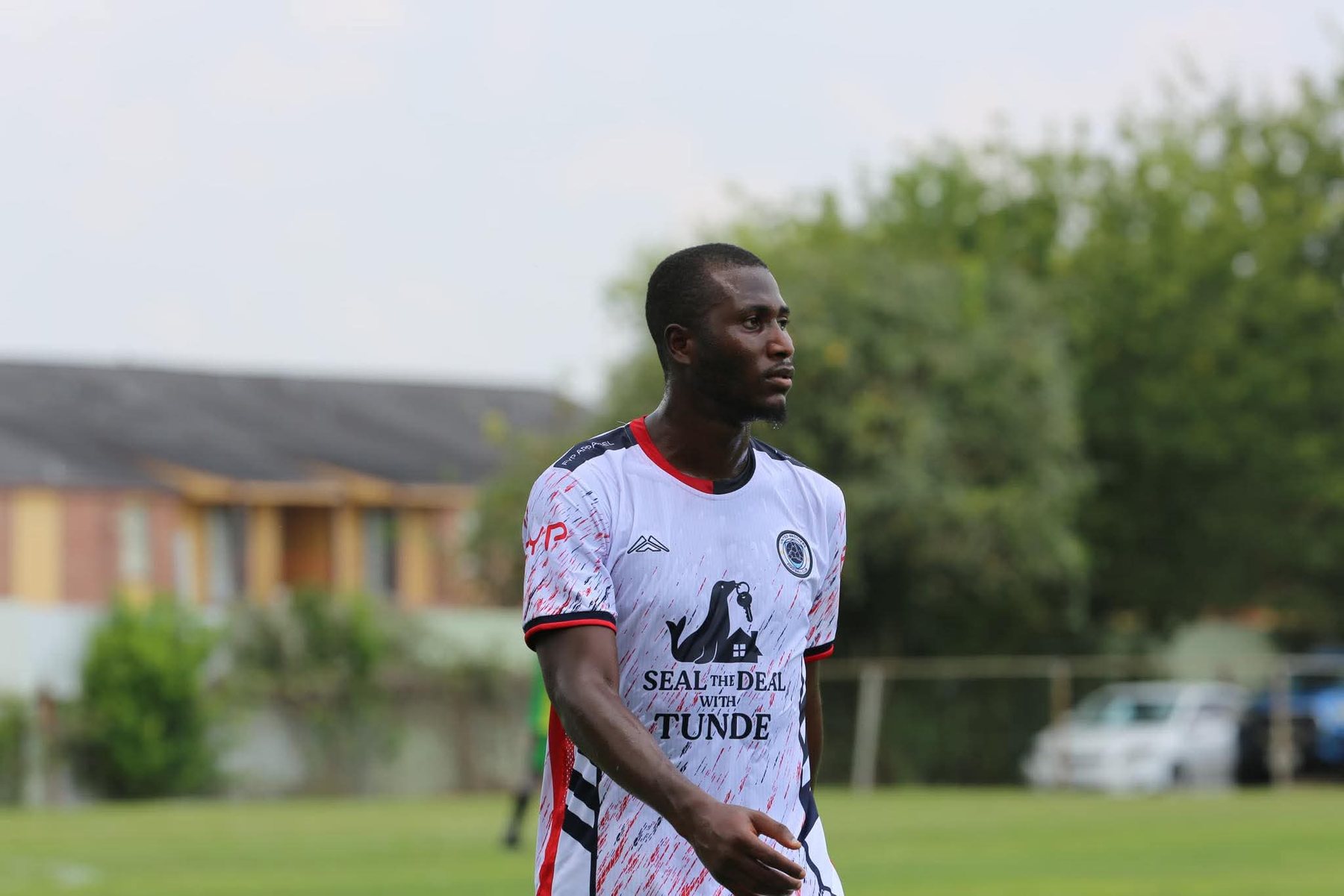 Player wearing sponsored football jersey
