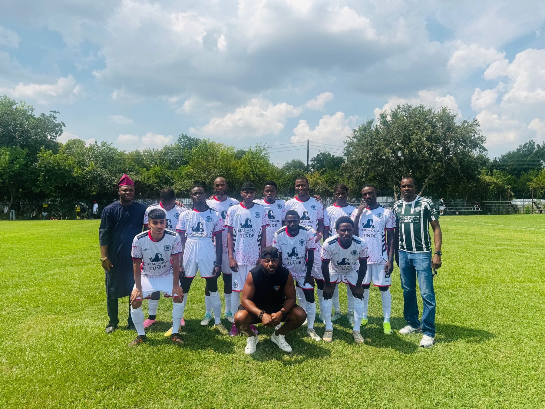 Community football team in sponsored jerseys
