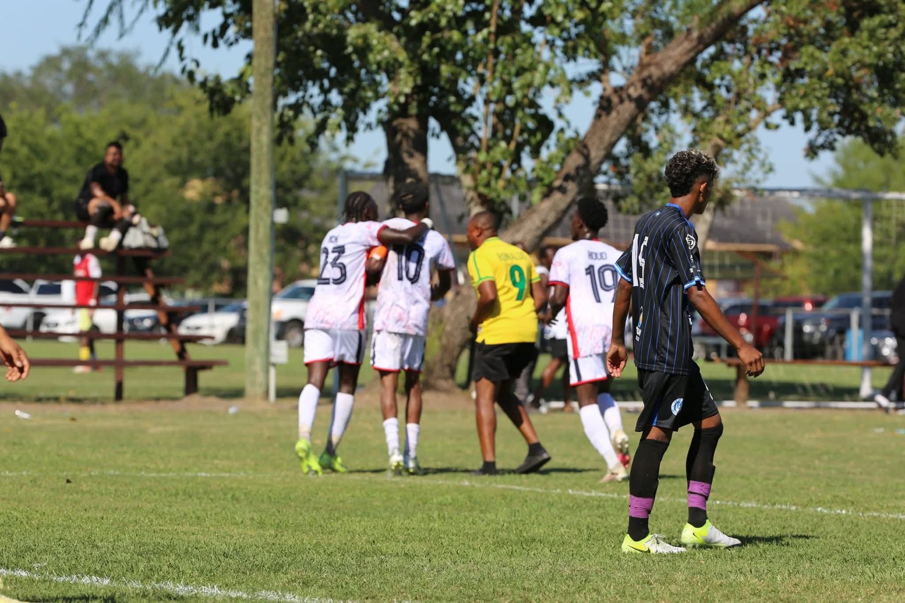 Football teammates together during a match